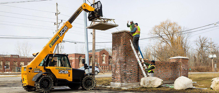 Limestone Caps Installed on Main Entrance Pillars
